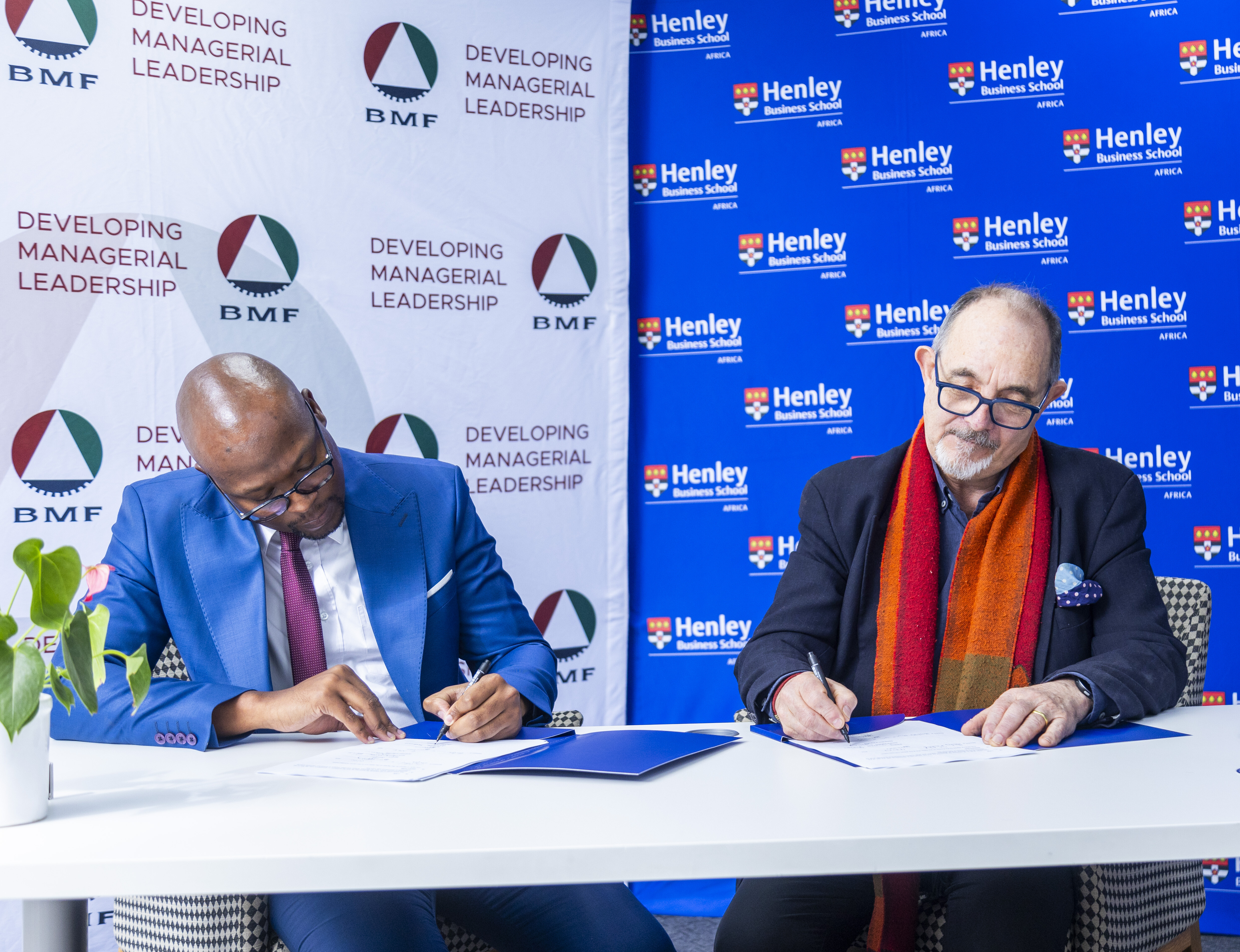 Jon Foster-Pedley and Monde Ndlovu sign and MOU between Henley Africa and the BMF